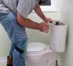 Plumber Fixing Toilet